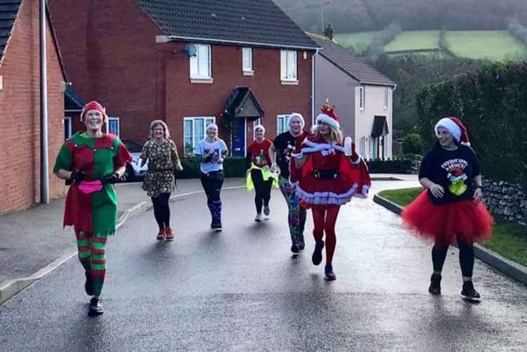 Alexa Baker, Alison Long,  Beccy Johnson, Tracy Scannell, Liz Goodman, Helen Akay and Jenny Kay bringing festive cheer to Sidmouth.