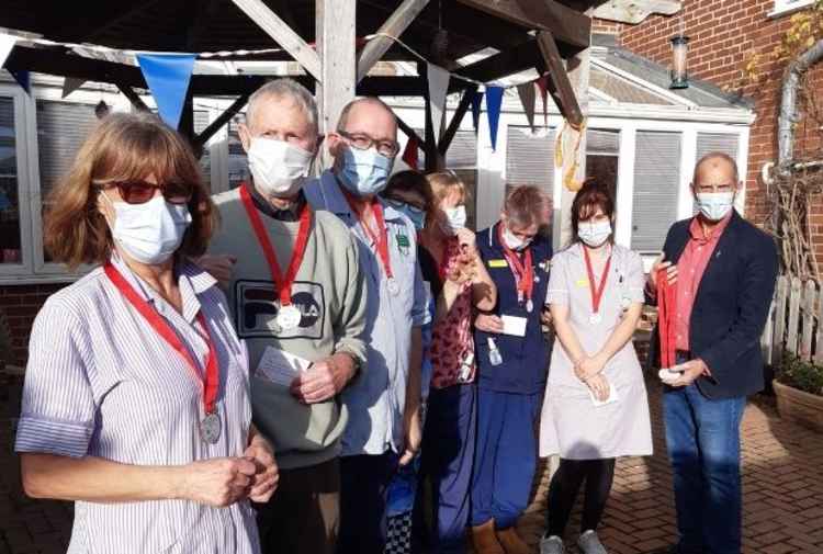 Staff wearing their Lockdown Hero medals