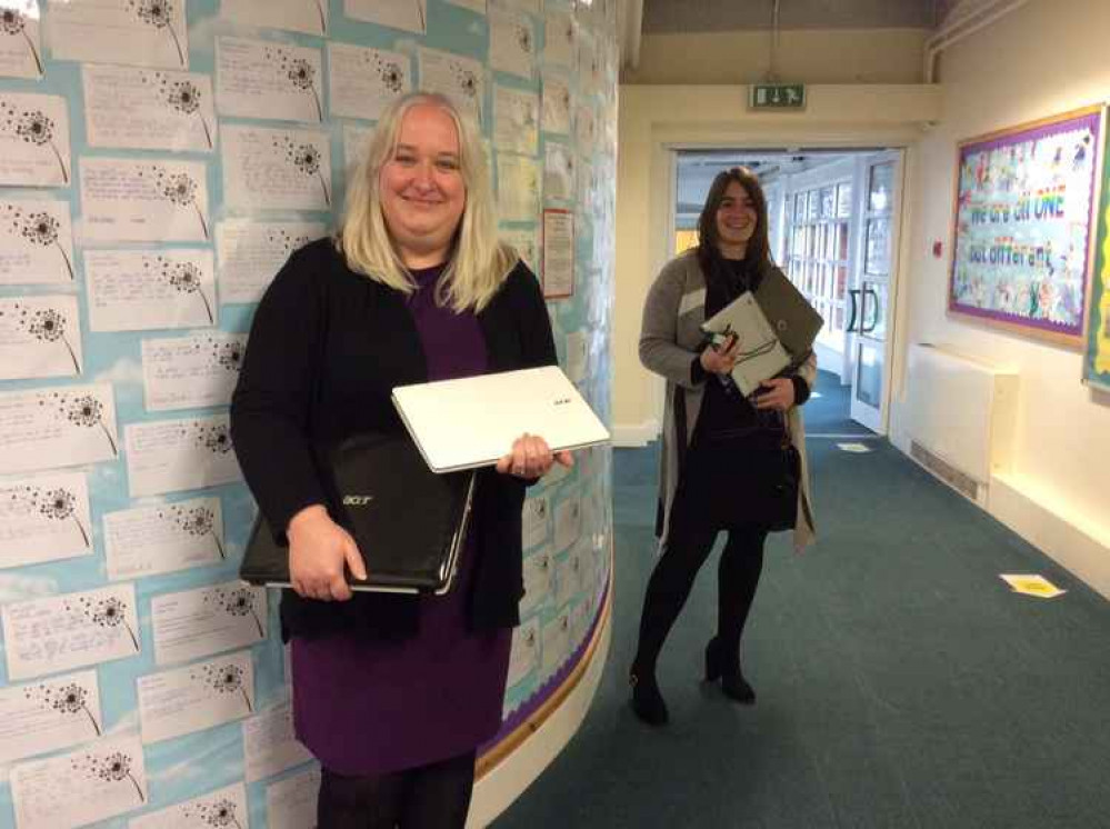 Head teacher Claire Fegan and deputy head Caroline Curtis with some of the donated laptops