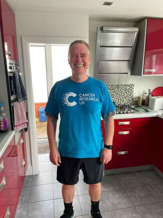 Derek Blackburn has the T-shirt having run 56 miles for Cancer Research