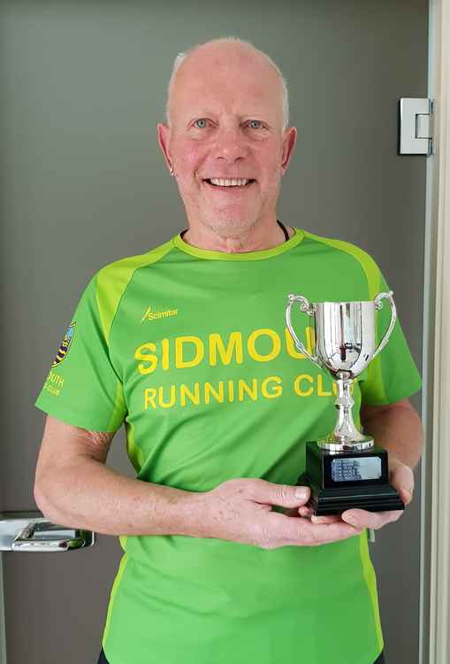 Chairman Terry Bewes, challenge mastermind, proudly holding the latest club trophy