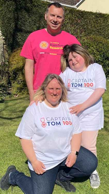 Wearing their Captain Tom 100 Challenge T shirts with pride