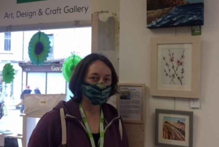 Artist Anna Brewster with her display at the Samaritans' gallery