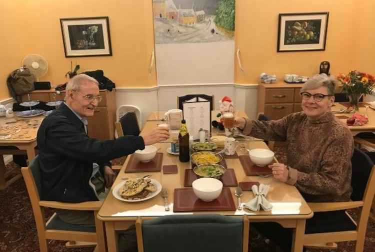 Jeff and his daughter having curry - pre-Covid