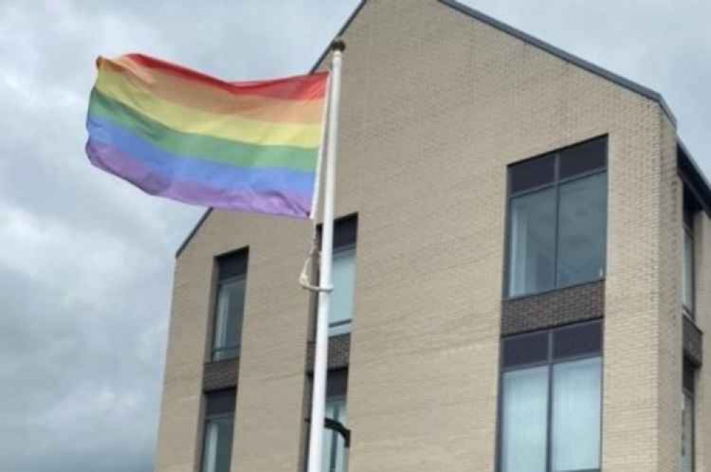 The rainbow Pride flag flying high outside the council's Honiton headquarters