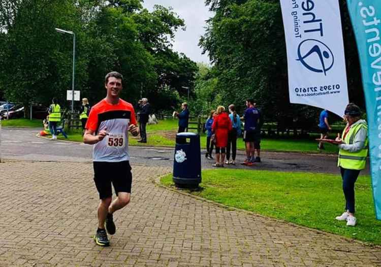 Jamie Locke crosses the finish line