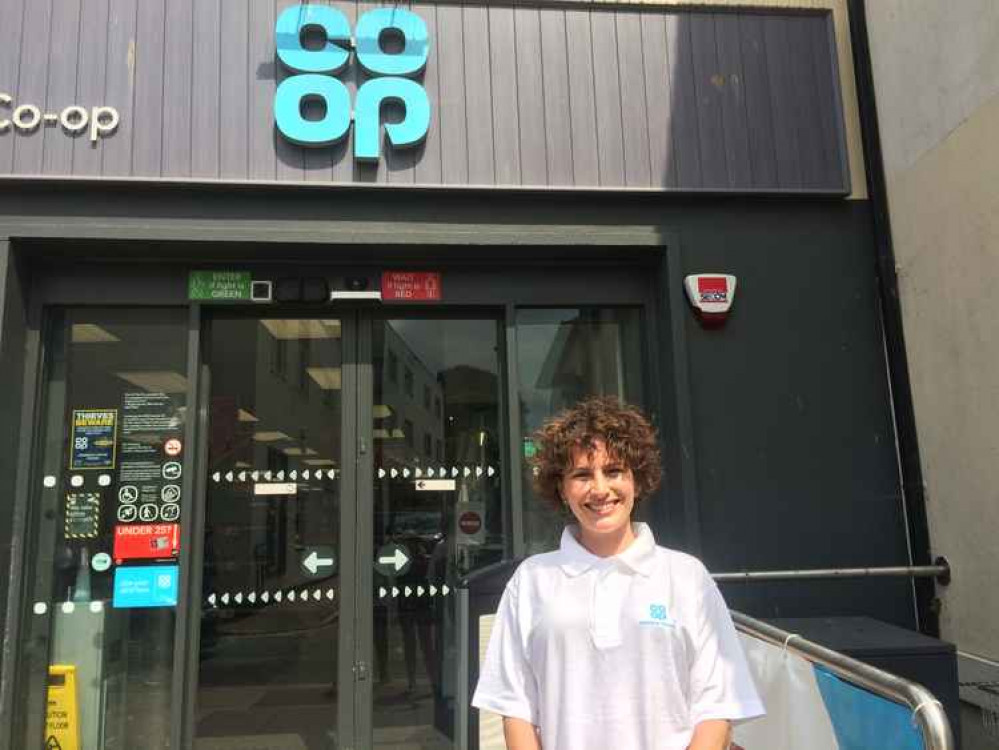 The Co-op Member Pioneer for Sidmouth and Seaton, Sarah Reed, outside the Sidmouth Co-op shop