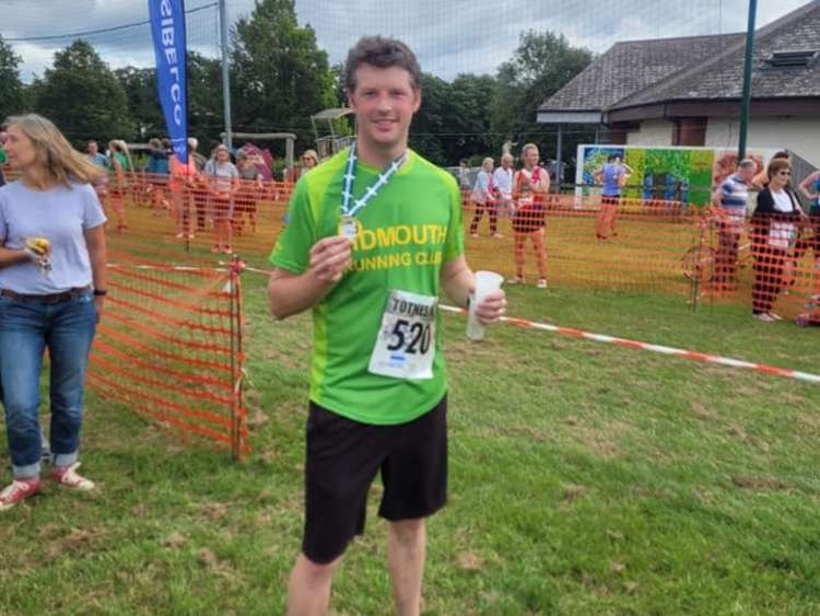 Jamie Locke wearing the Mighty Green shirt with pride