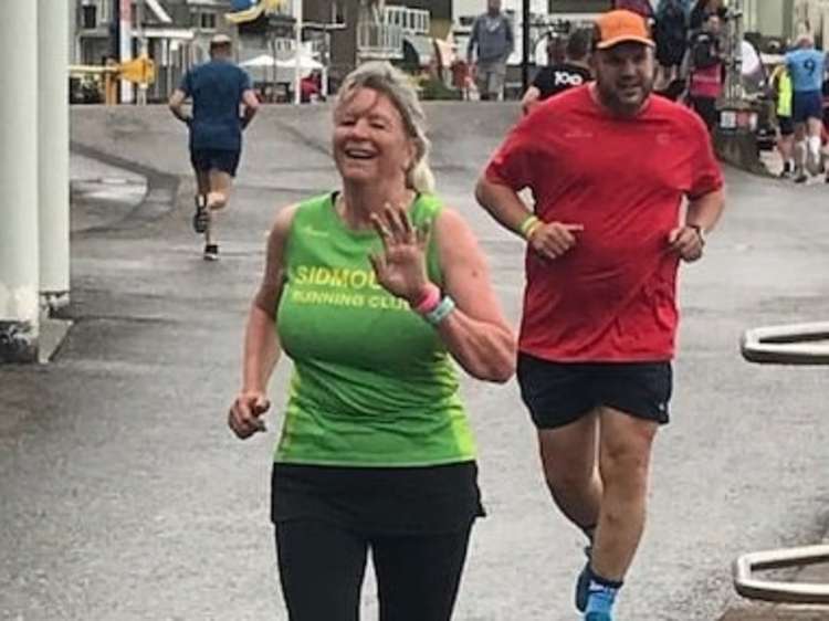 All smiles for Julia Haddrell as she completes her 100th park run.