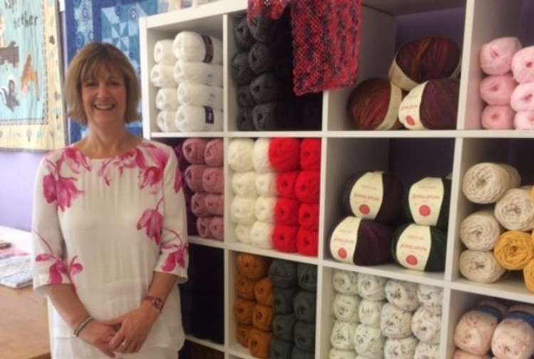 Julie Steeples with her new display of yarns in the shop