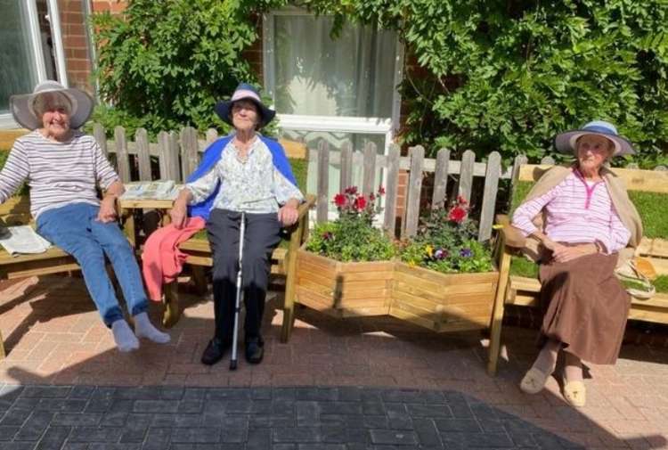 Doveridge residents enjoying the sun in their new garden