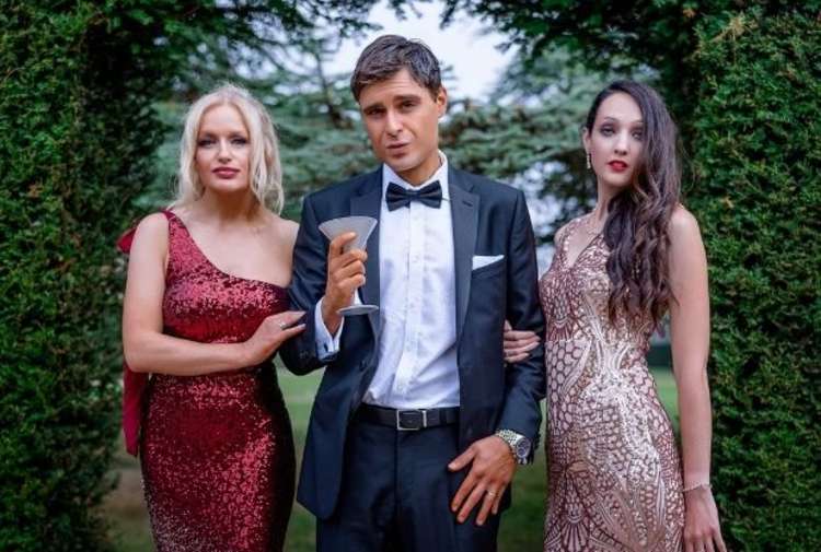 Ed in character as James Bond with 'Bond girls' Helen Akay and Misty Tee. Picture: Chris Woodman