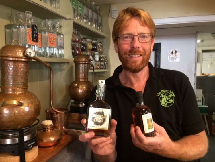 John Hammond with the two award-winning drinks, Christmas Cheer Gin and Crab Apple Liqueur