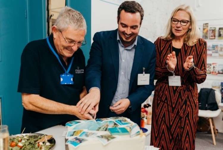 Simon Jupp MP cuts the cake with TIC manager Jeff Bailey and Chair of Tourism and Economy Louise Cole. Picture: Sarah Hall