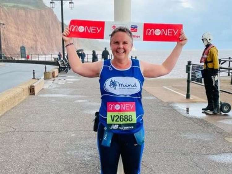 Rachel Austen-Rigby at the end of her virtual marathon along Sidmouth seafront