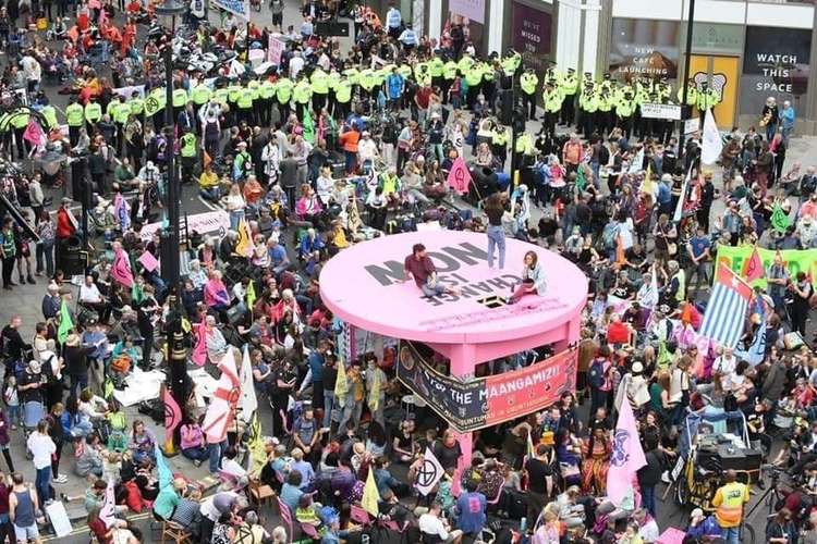 Giant pink table in Covent Garden at the start of the Impossible Rebellion, 23 August (Image: Extinction Rebellion)