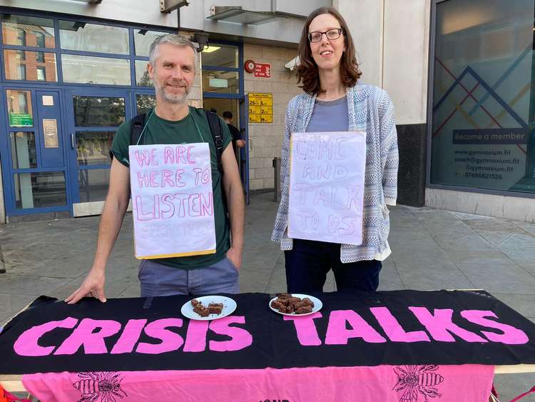 Pink table with Marcin and Chloe outside Southside shopping centre on 28 August (Image: Extinction Rebellion)