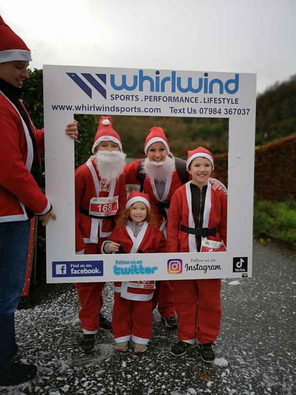 A family at Whirlwind Sports' snow station at last year's Santas on the Run at Eden