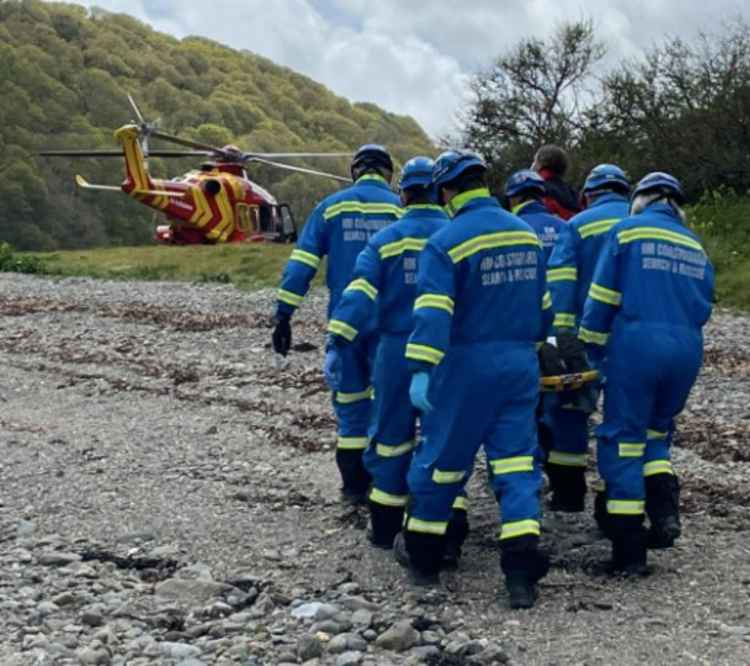 The teams carrying the casualty.