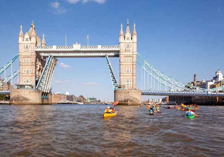 Tower Bridge opens.