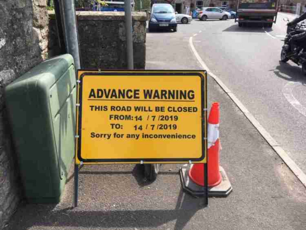 The sign announcing the road closure