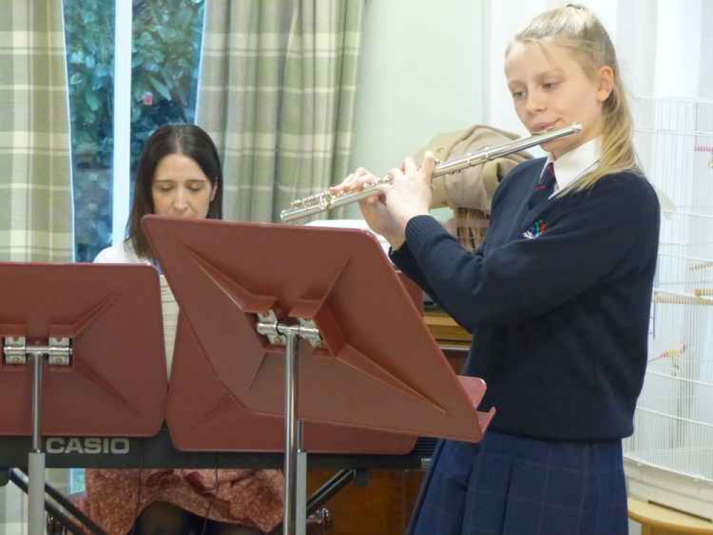 A Millfield Prep pupil performing at a care home last year before lockdown