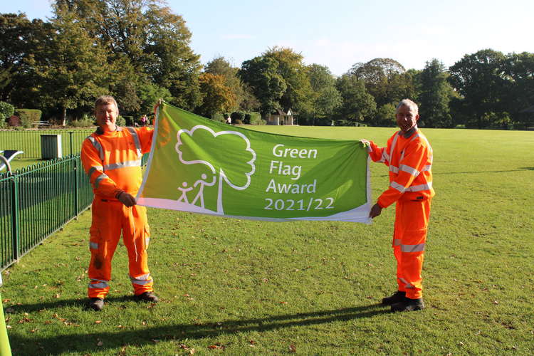 Barry and Danny of idVerde holding the 2021-22 Green Flag for Collett Park