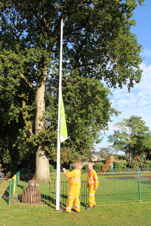 Barry and Danny of idVerde raising the 2021-22 Green Flag for Collett Park