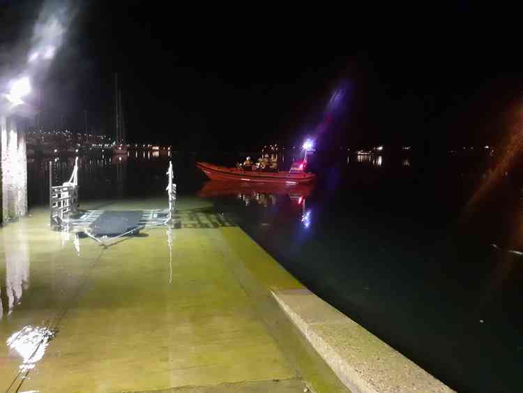 Image shows the volunteer crew and inshore lifeboat heading out to the rescue (Falmouth RNLI)