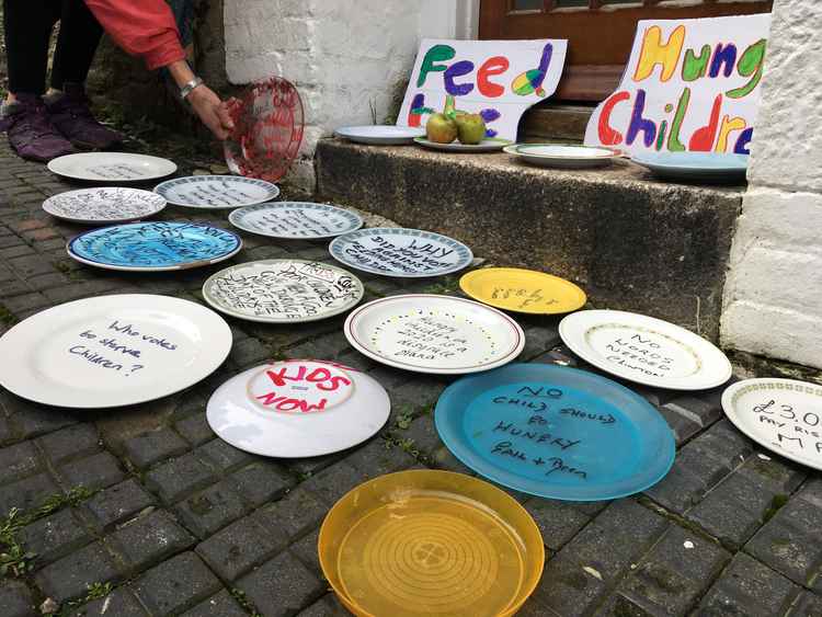 The empty plates places outside Cherilyn Mackrory MP's office in Truro in protest against her decision not to support providing free school meals during holidays