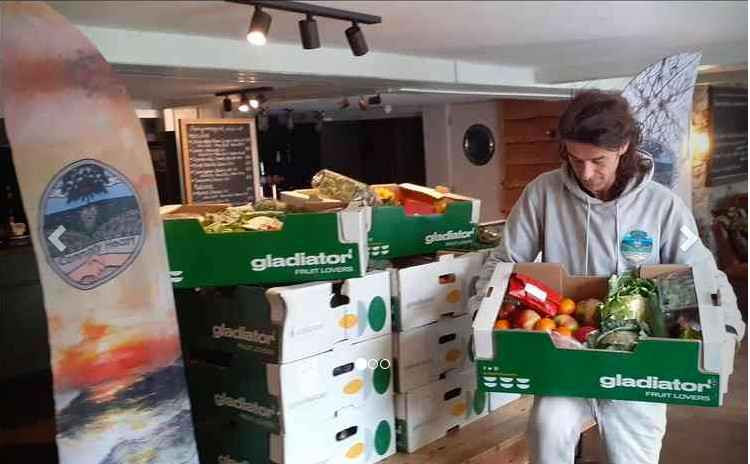 Robin Markland with the food boxes.