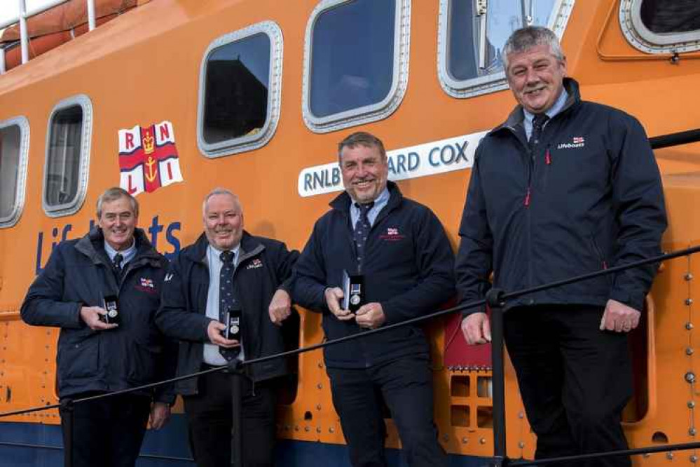 RNLI members with their awards