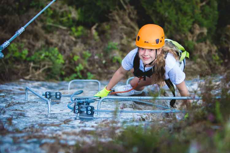 Climbing teen from above Via Ferrata Cornwall