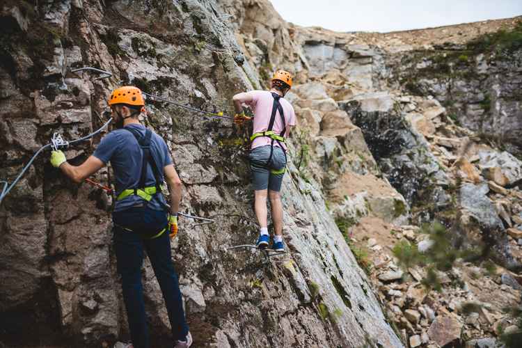 Men climbing quarry, Via Ferrata Cornwall