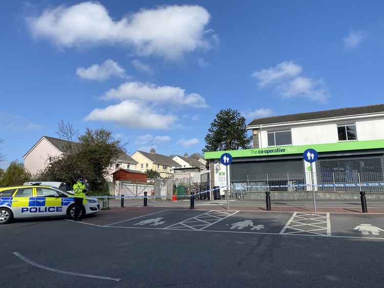 The police outside the coop.