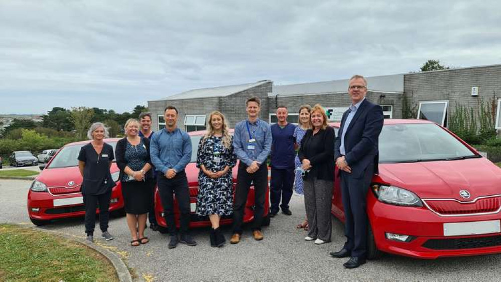 Members of Falmouth and Penryn Primary Care Network with their new electric cars