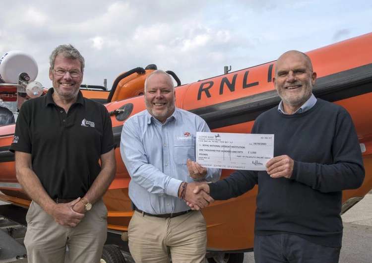 Nigel Sharp (Chairman, PoFSA), Dave Nicoll (Fundraising & Partnership, RNLI), Neil Andrew (Chair of PoFSA's race management group). Photo: RNLI/Simon Culliford.