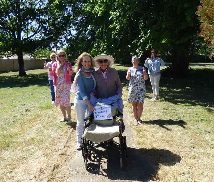 Joan with daughter Diane being cheered on by members of the WRAC association and a former WRAF