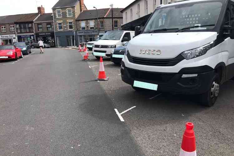 Cars Parked Behind Cones