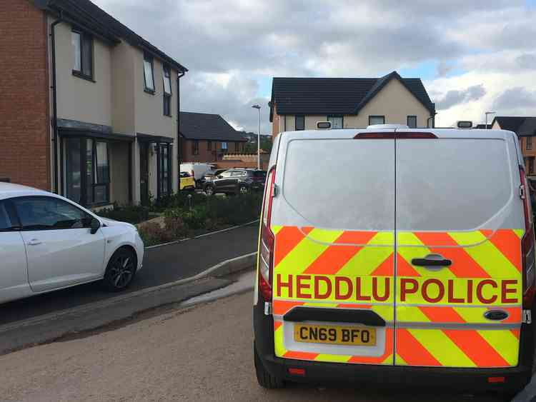 The area has now been cordoned off by police, but the man can be seen and heard from the road