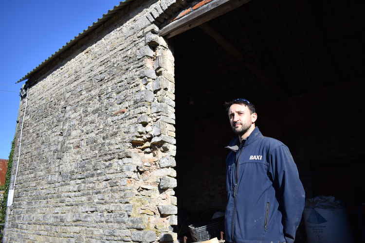 Jonathan Lambert standing in front of the barn at Cosmeston farm (Photo credit: Alex Seabrook)