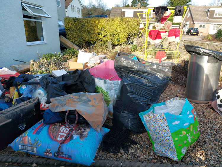 Santa hats are hung to dry while a damaged items have been removed from this house in Sully