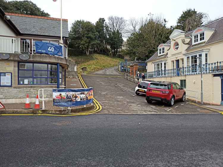 Area: Unnamed road adjacent to RNLI lifeboat station. TWO BIG CHANGES: 1) Introduction of imited Waiting 10.00 am to 7.00 pm for a maximum period of 2 hours, return prohibited within 2 hours on far side of station. 2) Introduction of no waiting at any tim