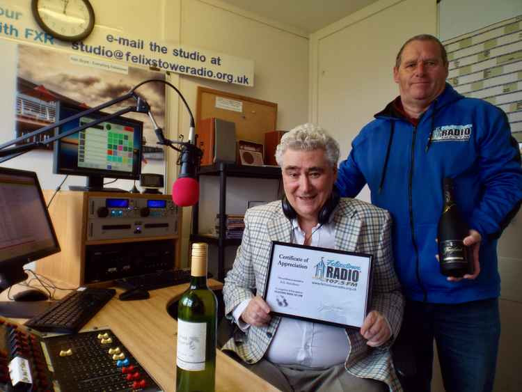 A surprised Bob Meadows presented with farewell gift by Felixstowe Radio director Steve Foley