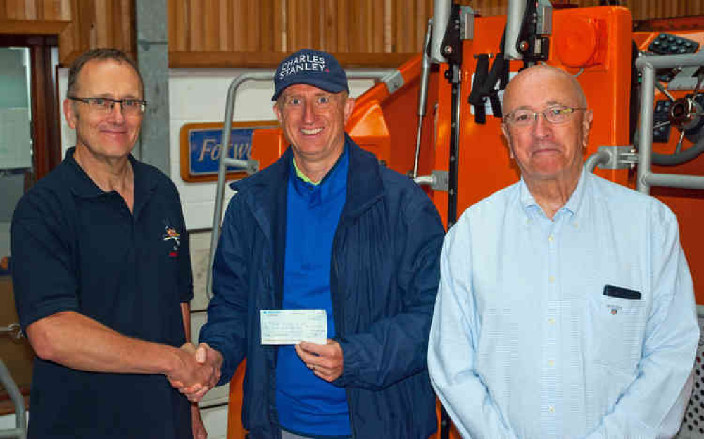 Chris presents his cheque to Exmouth RNLI. L to R : Simon Davidson, Chair – Exmouth Lifeboat Management Group, Charles Harris-Deane, Director of Investment Management at Charles Stanley Wealth Management and Robin Humphreys, Chair – Exmouth RNLI Fundr