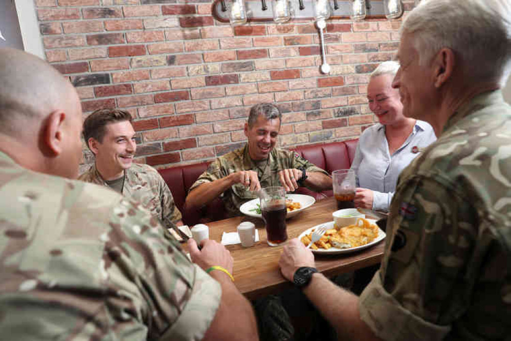 Military personnel enjoying a free breakfast. Image courtesy of Whitbread.