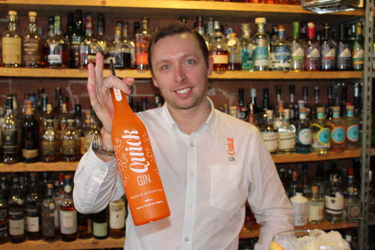 Exmouth landlord George Nightingale with a bottle of Quick Gin.