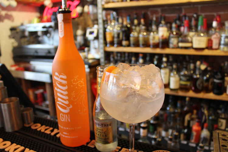 Quick Gin uses orange in its signature serve.