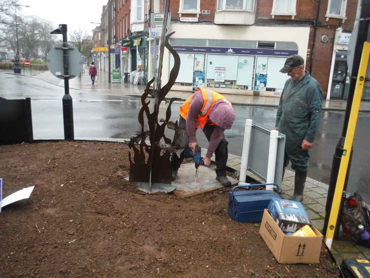 Fixing the sculptures to their plinths. Picture Exmouth In Bloom Fixing the sculptures to their plinths. Picture Exmouth In Bloom