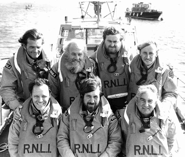 Exmouth RNLI in 1983, (left to right): Back: Reg Mogridge, Geoff Mears (Coxswain), Tim Mock (Assistant Mechanic), Bert Thomas. Front: Tom Chandler, Keith Graham (Second Coxswain), Bernard Bradford (Mechanic).